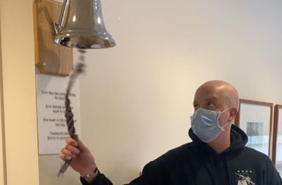 Chris Naimo rings the bell marking his final chemotherapy session in November 2020.